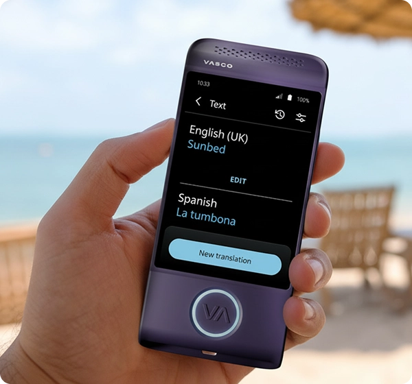 A close-up shot of a hand holding a purple Vasco electronic translator device. The screen displays a text translation from English (UK) to Spanish, showing the word 